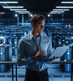 professional man holding a laptop